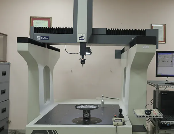 Coordinate Measuring Machine (CMM) inspecting the dimensions of a precision metal component