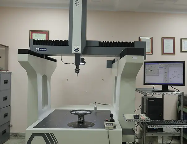 Engineer performing CMM dimensional inspection on a chassis bracket before dispatch