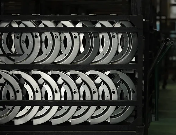 Conveyorized powder-coating line applying a protective finish to metal components