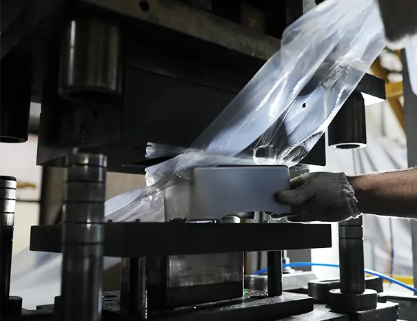 Precision stamping die forming a steel automotive engine bracket