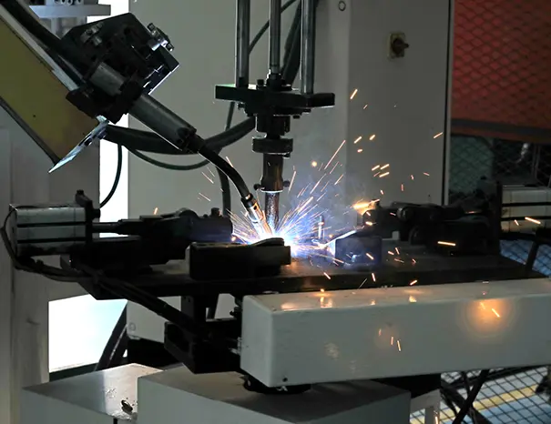 Robotic welding cell joining a chassis sub-assembly for automotive OEM supply