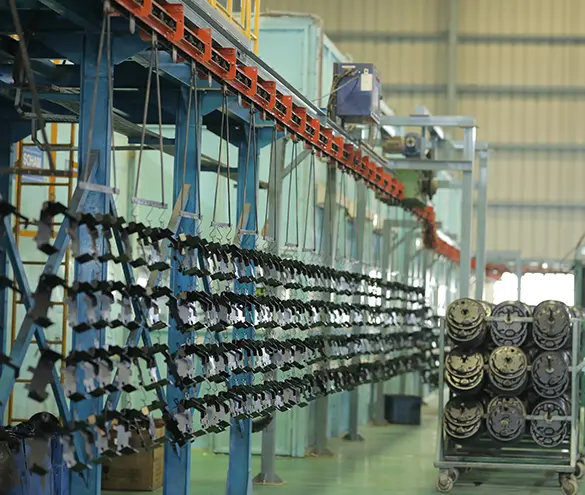 Powder-coated steel components on a conveyorised coating line