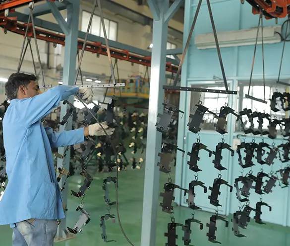 Powder-coated steel sub-assemblies moving on a conveyor line