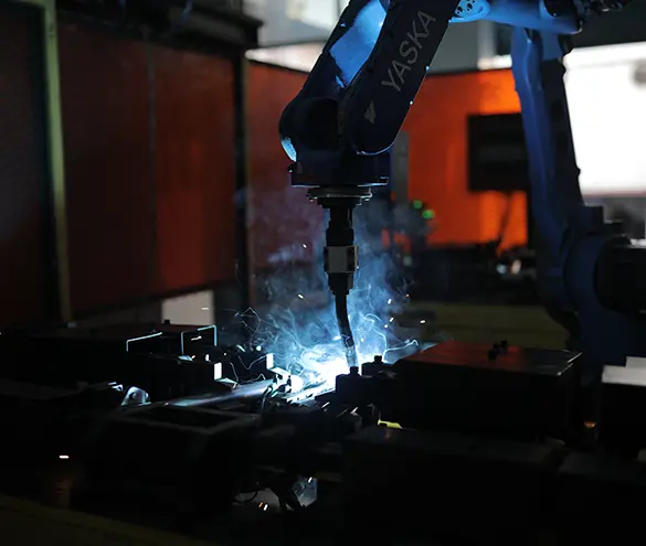 Robotic welding cell joining a two-wheeler frame sub-assembly