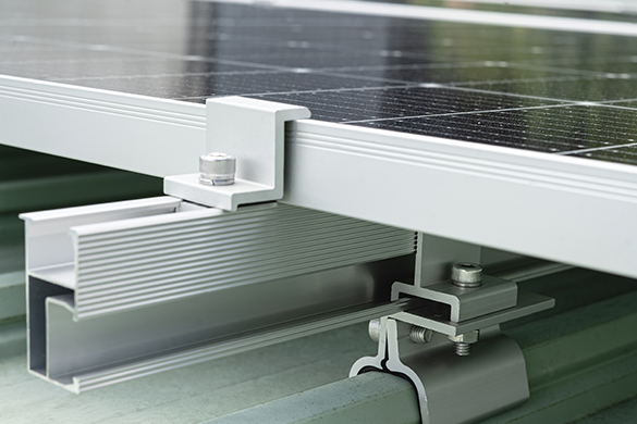 Pressed steel bracket connecting a purlin in a solar module mounting structure