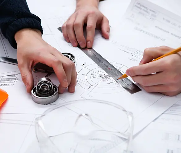 Engineer reviewing a sheet metal part drawing for a tractor RFQ